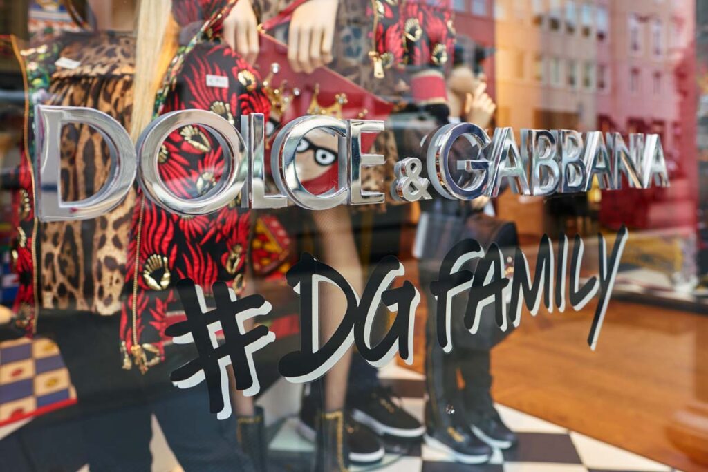 Close-up of Dolce & Gabbana signage in a store window, representing the Dolce & Gabbana class action lawsuit.