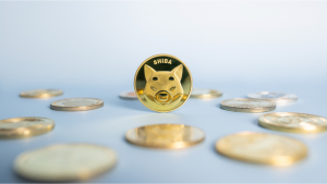 Shiba Inu (SHIB-USD) or Shib coin in the center among a bunch of cryptocurrencies on a blue background. Close-up, soft focus. Banner with golden Shiba token.